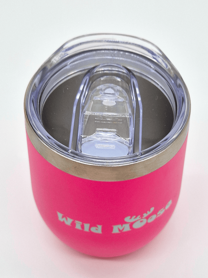 overview of the lid of brightly coloured pink 12oz wine tumbler