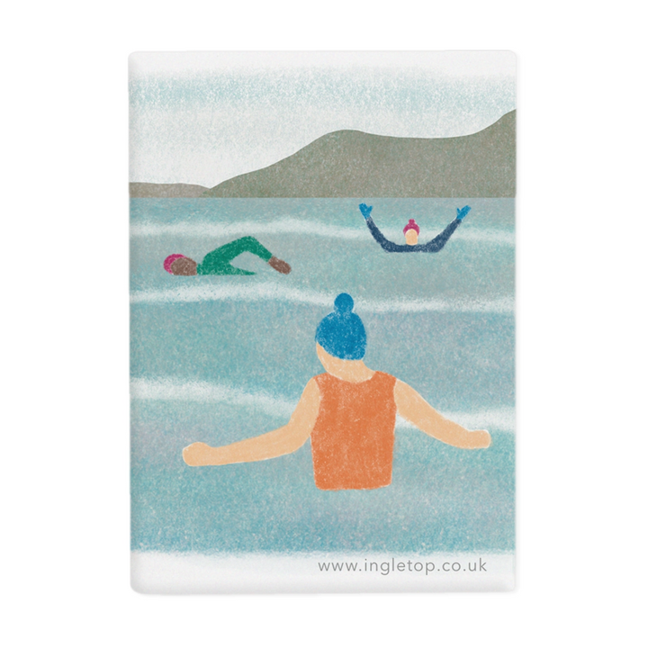 A fridge magnet with an illustration of a group of people wild swimming in an outdoor body of water, wearing bobble hats and swim gloves.