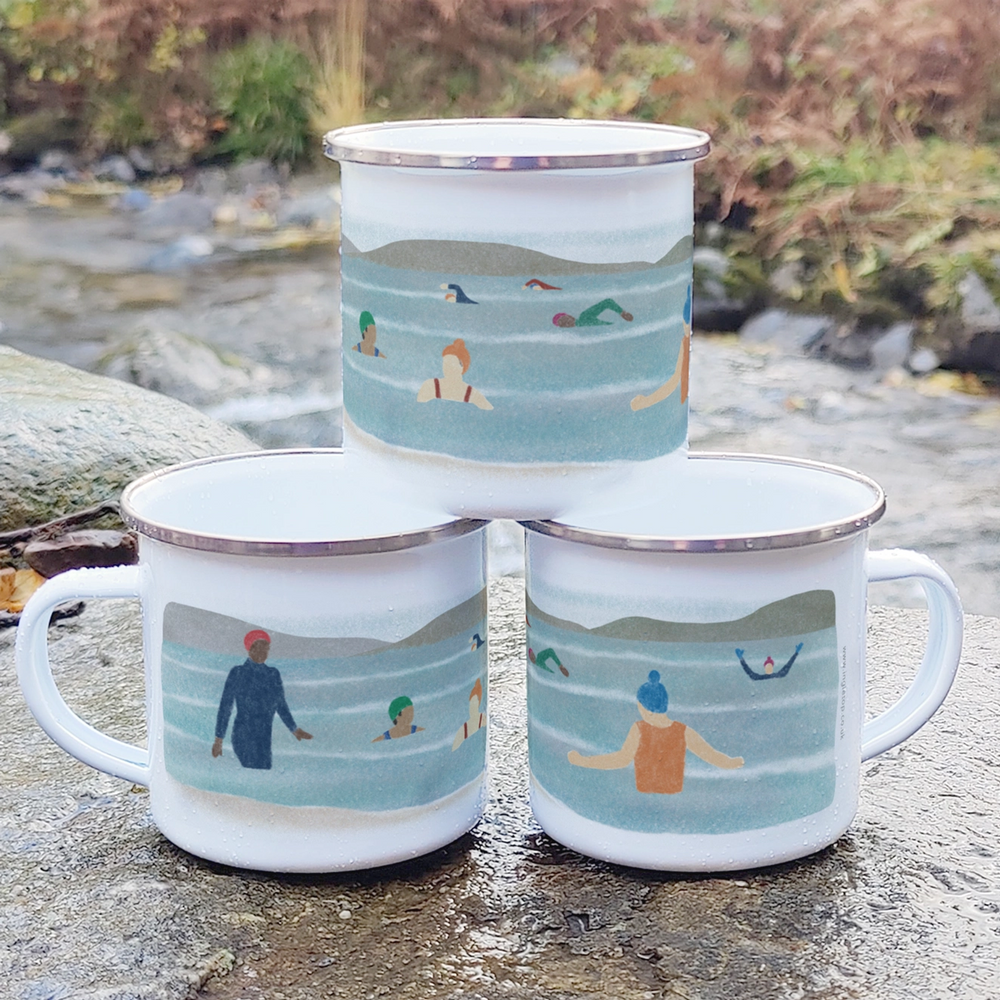 White enamel mug with an illustration of a group of wild swimmers enjoying a bracing dip!