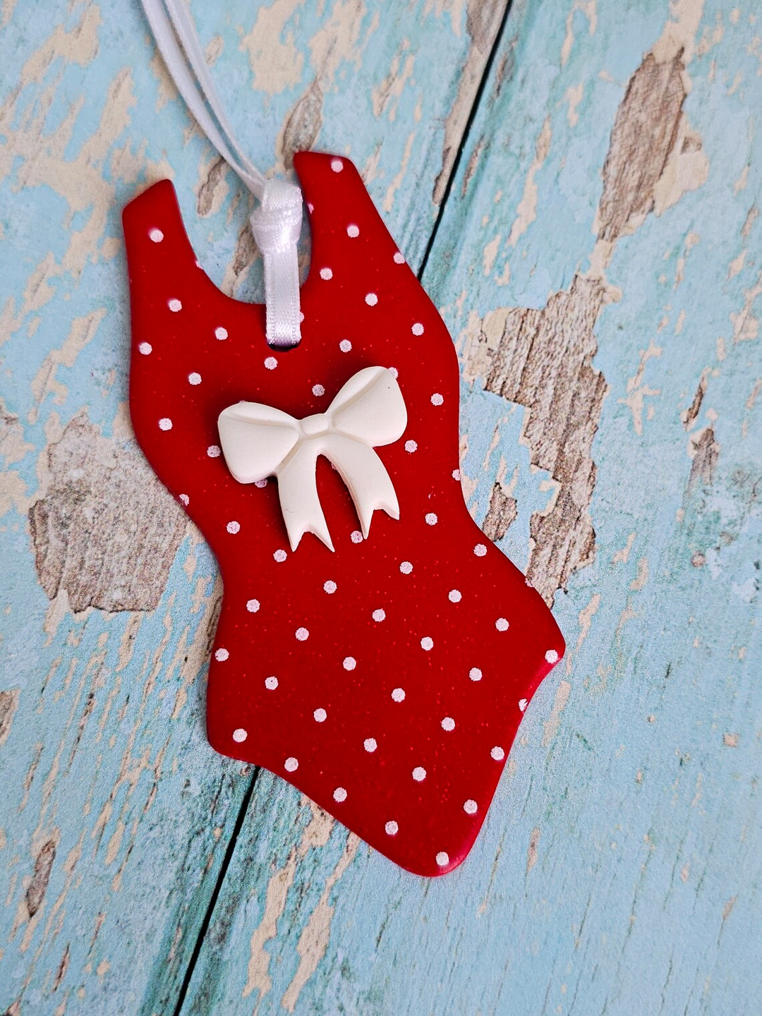 Handmade red swimsuit Christmas tree ornament with white polka dots and bow, finished with white satin ribbon – unique gift for swimmers.