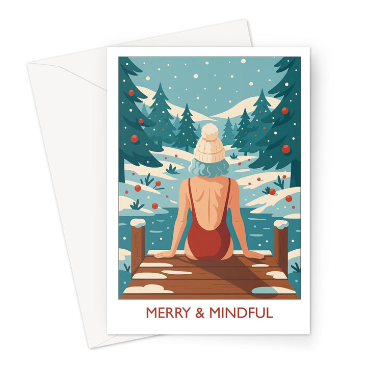 Merry & Mindful wild swimming Christmas card showing a swimmer in a red swimsuit and bobble hat sitting on a snowy jetty surrounded by pine trees.