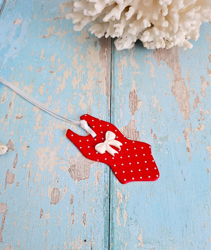 Handmade red polka dot swimsuit decoration with white bow – festive ornament or gift for wild swimmers.
