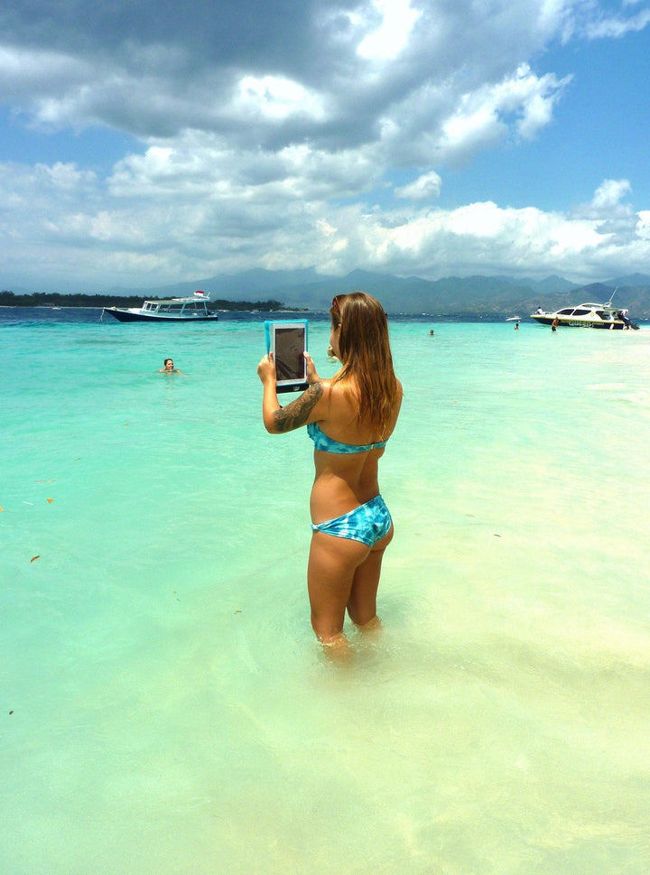 SwimCell Small Blue Tablet waterproof case in use