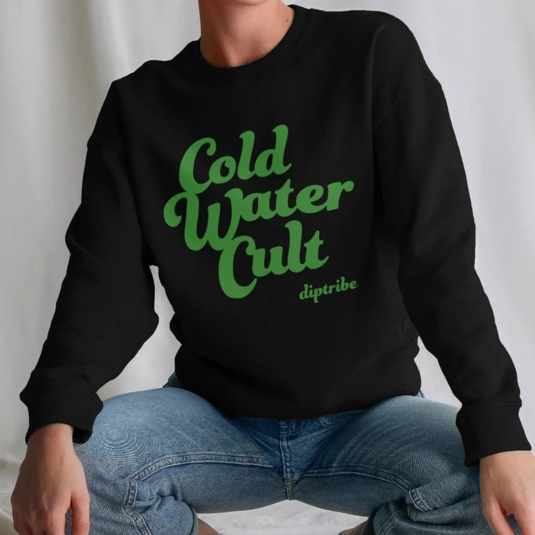 Person wearing a diptribe black sweatshirt with 'Cold Water Cult' in green text in large front written on the front 