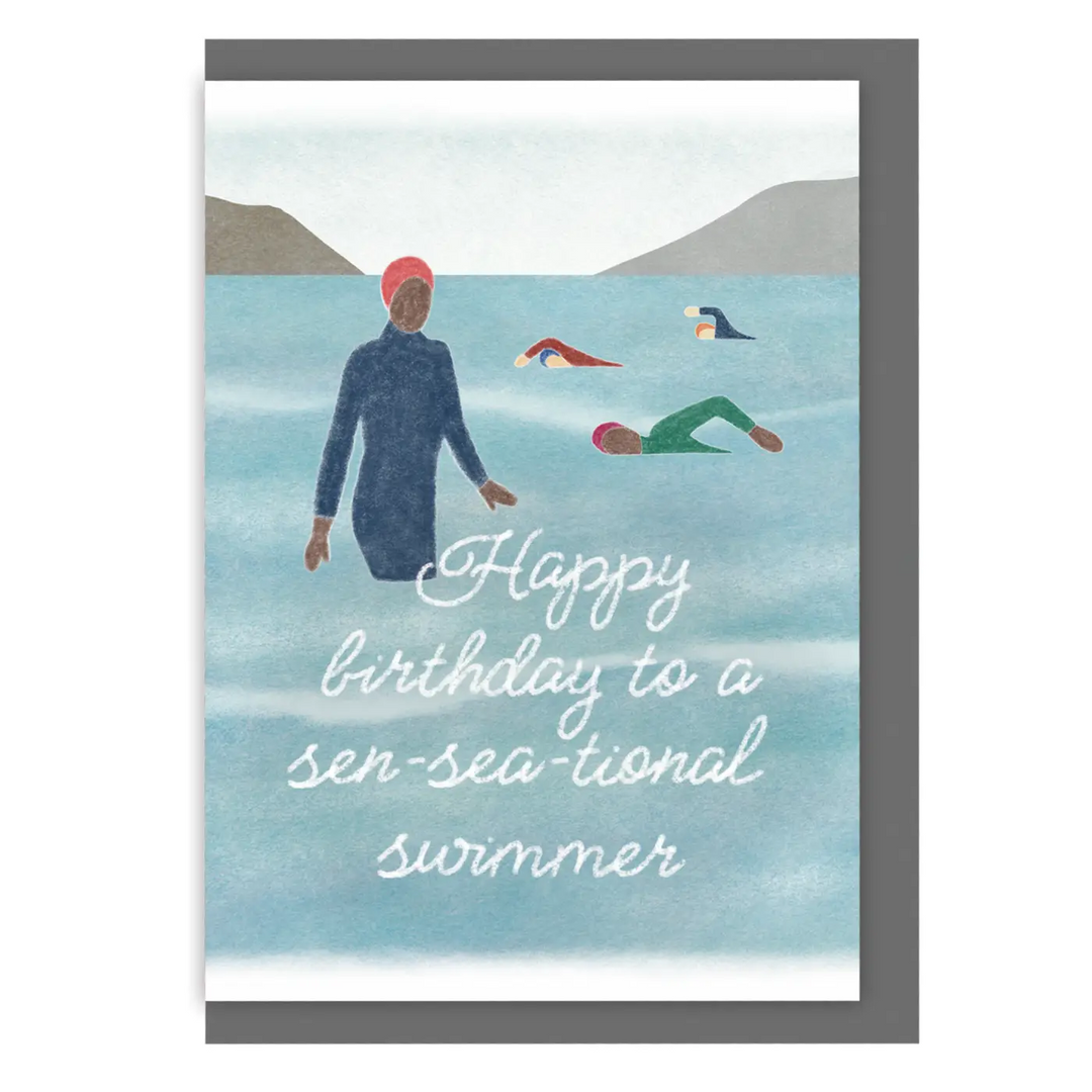 Greeting card with an illustration of several people swimming in open water with a caption that reads 'Happy birthday to a sen-sea-tional swimmer'.