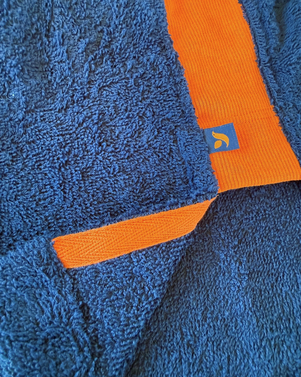 Brighton Blue and Orange long hoodie by So English featuring hem detail, made in the UK, casual and stylish beachwear.