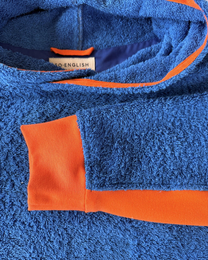 So English Bude long hoodie in Brighton Blue and Orange, featuring a cozy neckline and casual beachwear style.