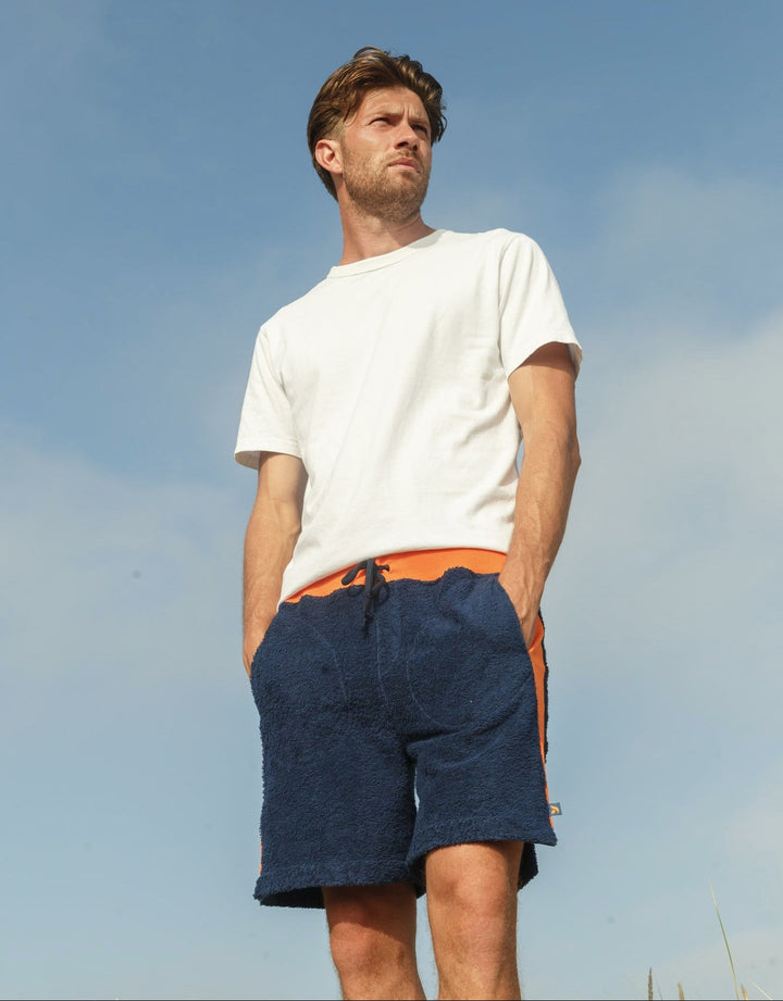 Navy and orange Bear shorts by So English featuring a casual beachwear style, made in the UK with comfortable fabric.