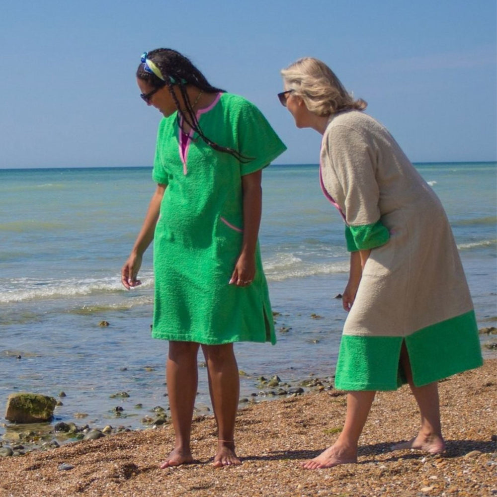 Image of two women on the beach wearing So English towelling beach cover ups