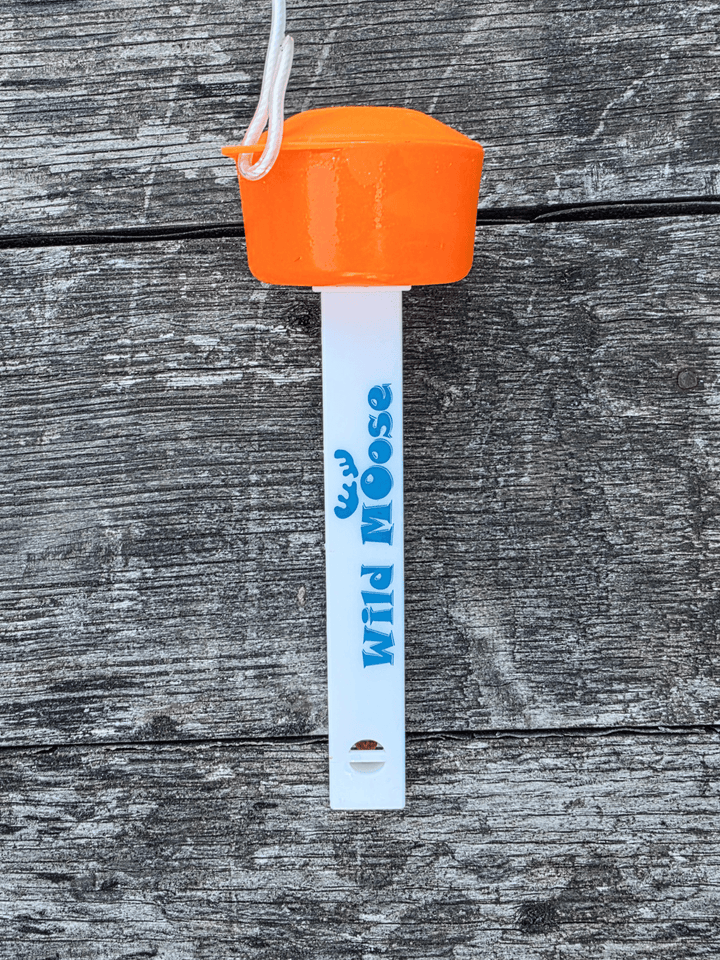The back of a floating thermometer for outdoor swimming. It has an orange cap and white body printed with the brand name &