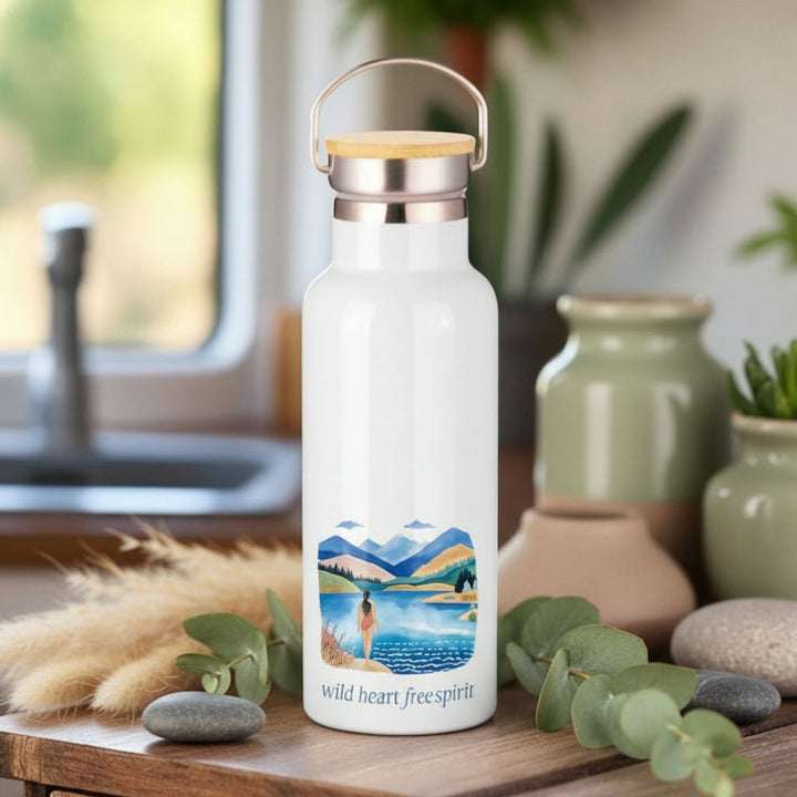 White water bottle with a scenic design and &