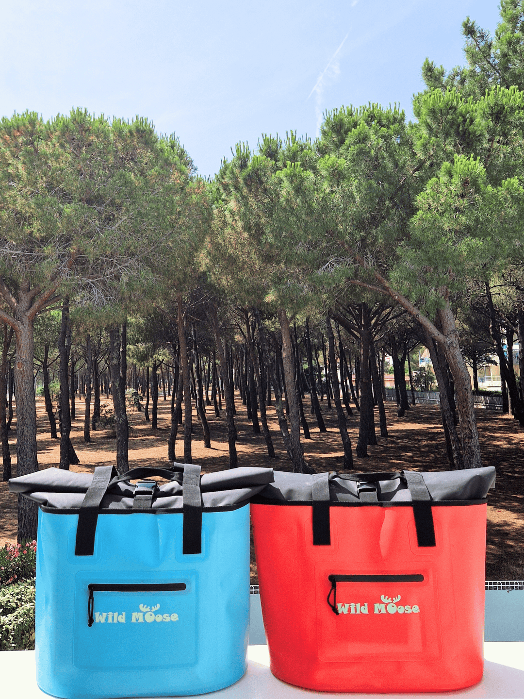 Wild Moose waterproof roll-top tote bags, made from recycled fabric and ideal for outdoor adventures. Incorporates an insulated pocket where you can store a hot water bottle in winter or keep your picnic items fresh in summer