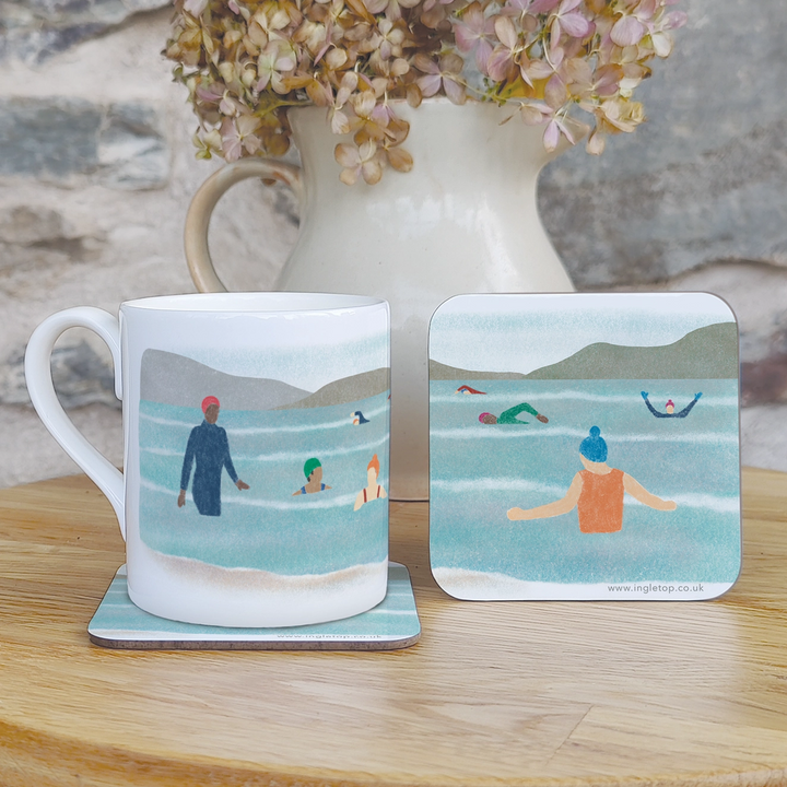 Wild Swimming coaster featuring an illustration of a group of outdoor swimmers enjoying an invigorating dip.