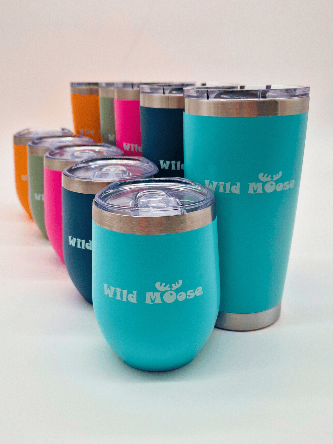 5 x small and 5 x tall brightly coloured tumblers in a row