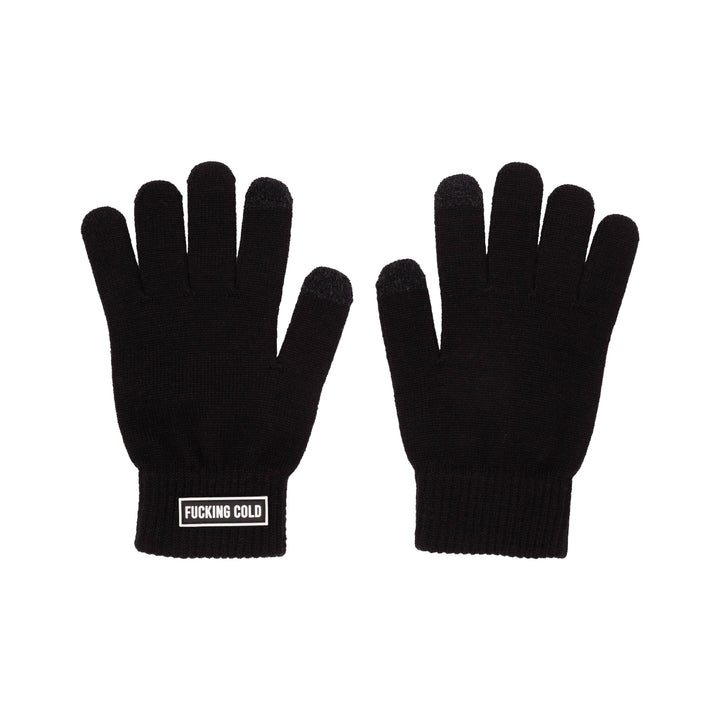 A pair of black knit gloves shown flat against a solid white background, with one glove displaying a white rectangular patch that reads &
