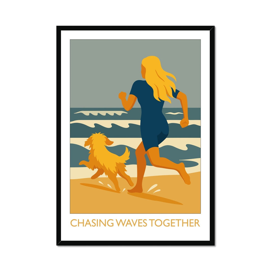 Framed wild swimming art print in black frame featuring a swimmer and dog running along the beach, Chasing Waves Together.