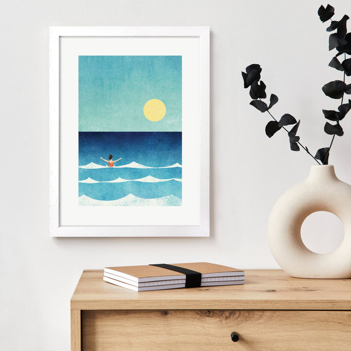Dip in the Sea art print displayed in a white frame in a contemporary home setting.