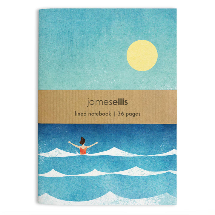 Dip in the Sea A6 notebook by Henry Rivers featuring a lone swimmer in the ocean beneath a golden sun on the front cover.