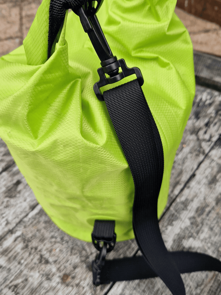 close up of shoulder strap of neon green 5L dry bag
