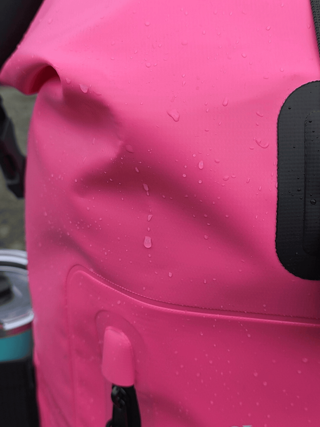 Close-up of a pink bag with water droplets on it
