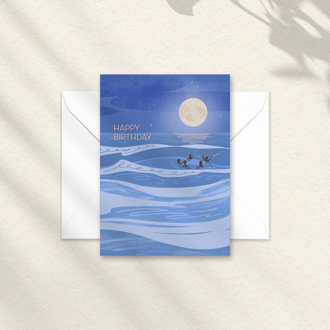 Happy Birthday mini A7 swimming card by Onneke featuring a group of swimmers in the sea beneath a full moon.