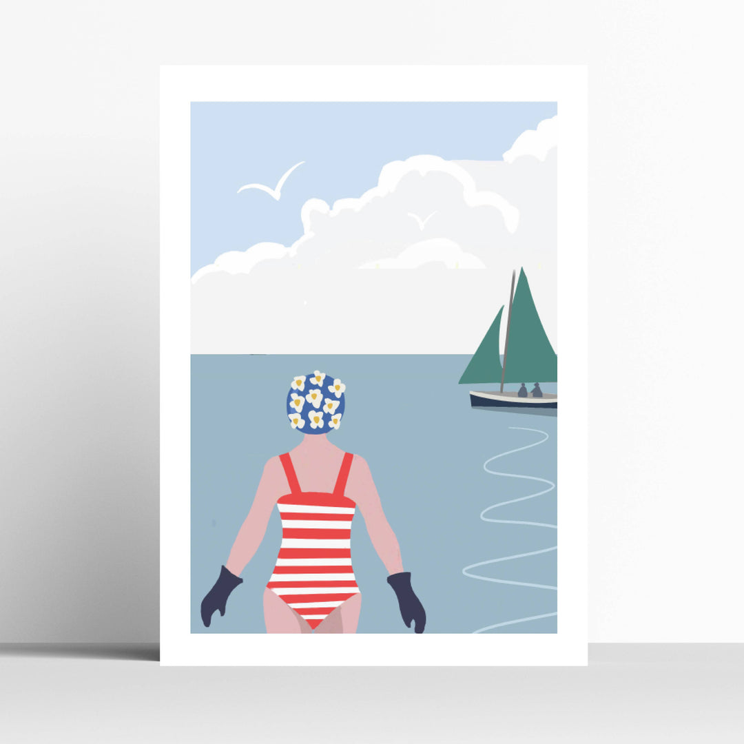 A minimalist art print featuring a swimmer in a red and white striped swimsuit and blue floral swim cap, standing in a blue sea with a green sailboat under a cloudy sky.