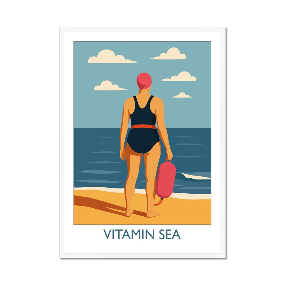 Framed wild swimming art print in white frame featuring a swimmer holding a tow float at the shoreline, titled Vitamin Sea