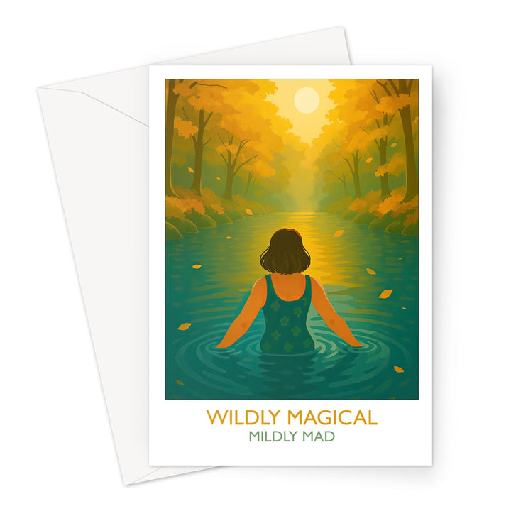 Front of the Wildly Magical Mildly Mad greeting card by Wild Swim Studio — an illustration of a wild swimmer wading into a golden lit autumn river, celebrating the joy and 'madness' of open water swimming in autumn.